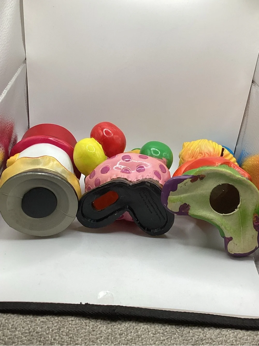 Three vintage 1980s hard plastic circus clown coin banks